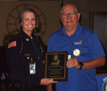 President Greg McCune presented Riley County Police Department Deputy Director Erin Freidline the Manhattan Optimist Law Enforcement Award.